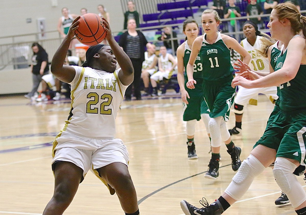 Image: Taleyia Wilson(22) rebounds a missed free throw for the Lady Gladiators.