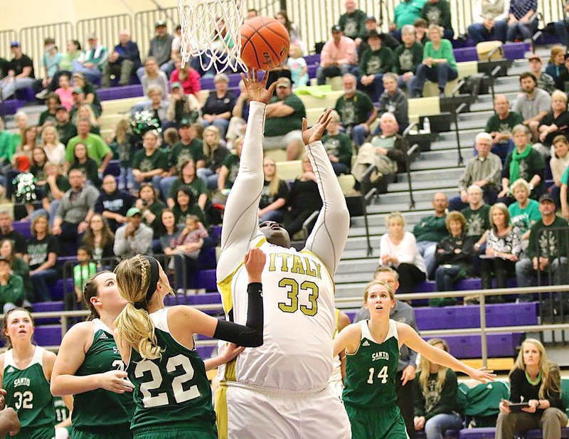Image: Lady Gladiator Cory Chance(33) scores from the low block with little resistance from Santo.