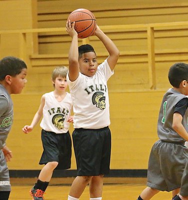 Image: J.J. Acosta(4) rebounds a miss and then looks for his guard to outlet the ball. 
    Levi Joffre is behind you J.J.!