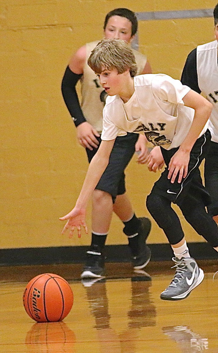 Image: Italy White’s Reese Janek(12) enters the frame pushing the ball up court and away from the opponent.