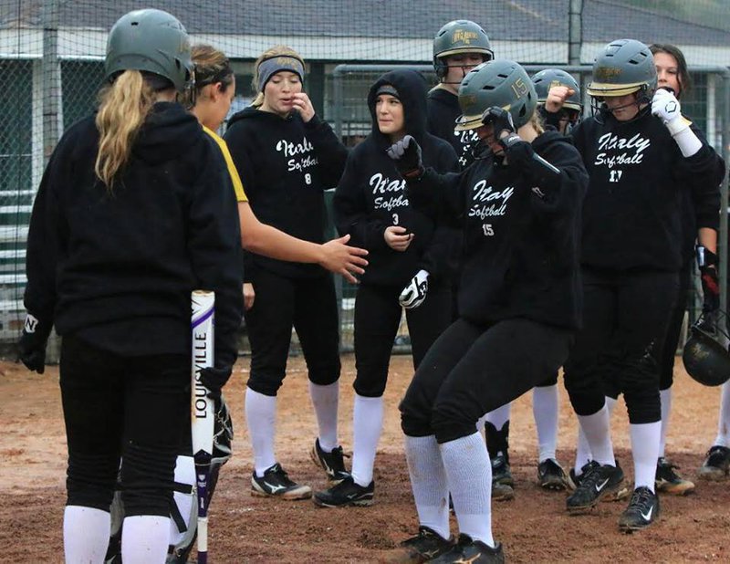 Image: Italy senior Lady Gladiator Jaclynn Lewis stomps home plate after hitting her 3rd over-the-fence homerun during the tournament, with her last blast occurring against Goliad. And in the background a man in a green shirt was yelling, “DON’T PITCH TO #15!!!”