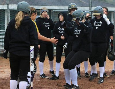 Image: Italy senior Lady Gladiator Jaclynn Lewis stomps home plate after hitting her 3rd over-the-fence homerun during the tournament, with her last blast occurring against Goliad. And in the background a man in a green shirt was yelling, “DON’T PITCH TO #15!!!”
