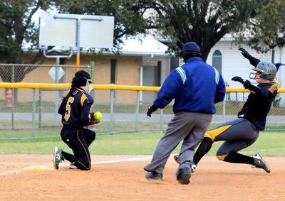 Image: Italy senior Madison Washington tries to slide safely into third-base….Did she make it?