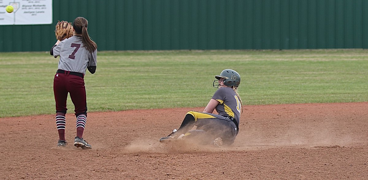 Image: Italy senior Madison Washington(10) slides in to beat the throw at second-base.
