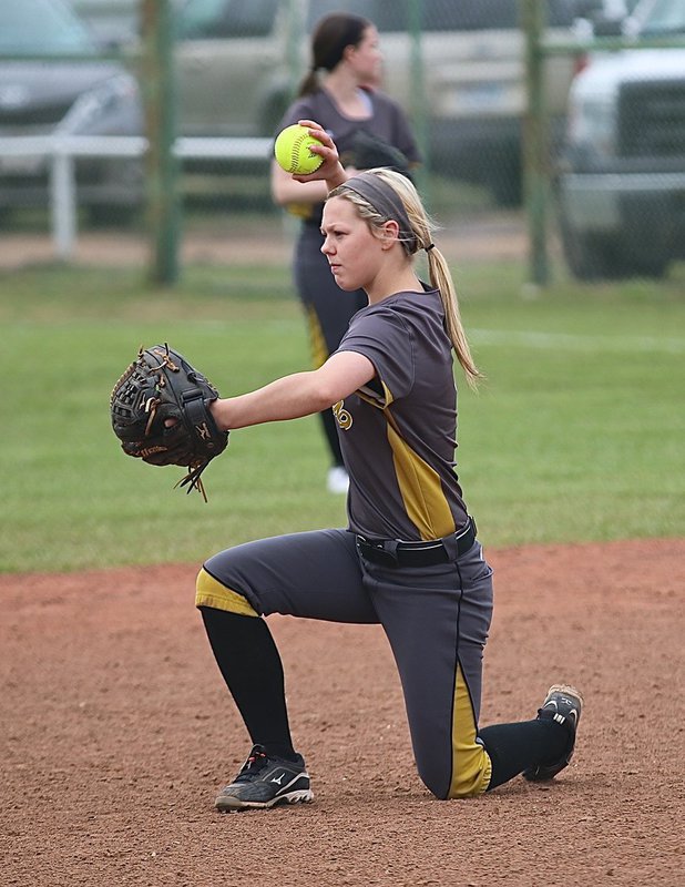 Image: Lady Gladiator Bailey Eubank(1) warms up at second-base between innings.