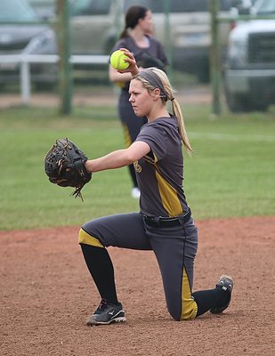 Image: Lady Gladiator Bailey Eubank(1) warms up at second-base between innings.