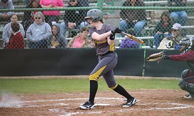 Image: Lady Gladiator senior Kelsey Nelson(14) connects on a Mildred pitch.