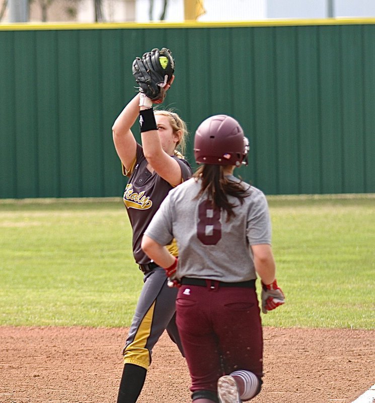 Image: Freshman first-baseman Brycelen Richards snags the throw from her pitcher, Jaclynn Lewis, for an Italy out.