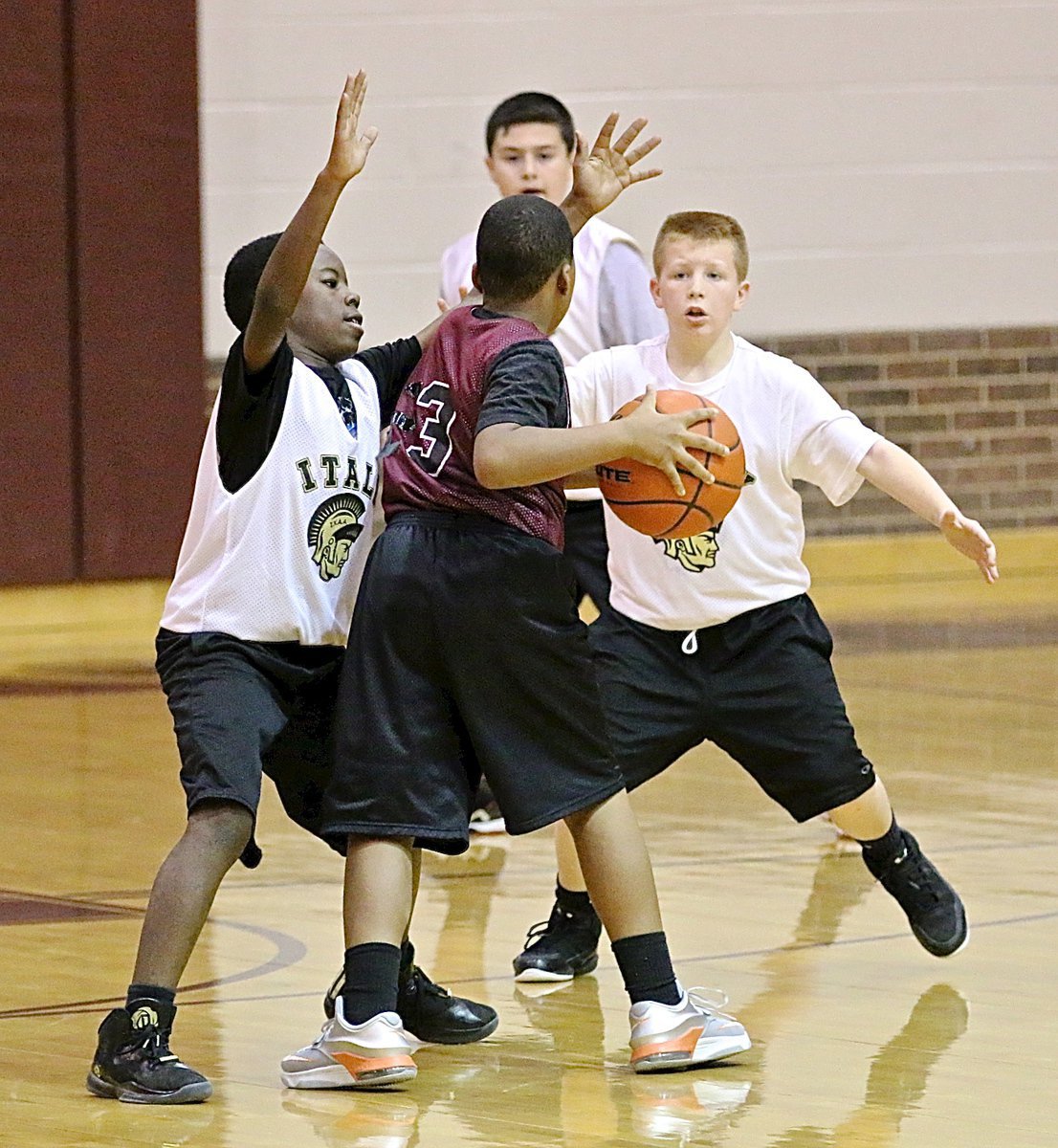 Image: Julius WIlliams(15) and Ty Cash(10) clamp down on Hillsboro’s guard.