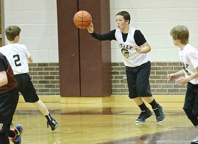 Image: Jayden Saxon(8) rebounds a Hillsboro miss and then outlet passes to teammate Kort Holley(2).