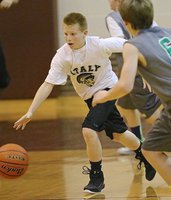 Image: Ty Cash(10) breaks away and scores a layup to finish his one-man fast break.