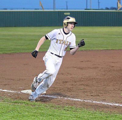Image: Italy’s Clayton Miller(6) bunts his way around the bases. It doesn’t go down in the books as a homer but it sure was fun.