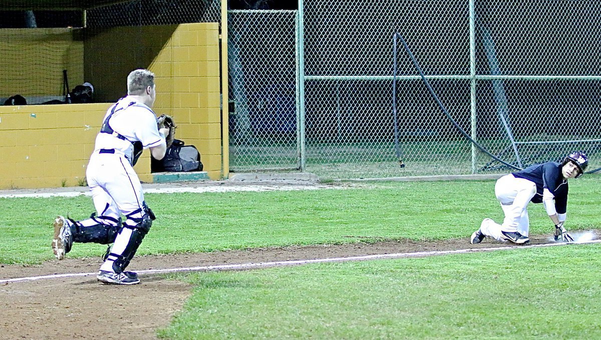 Image: Gotcha! Senior Gladiator catcher John Escamilla(7) catches an Eagle runner in a run down between home and third.