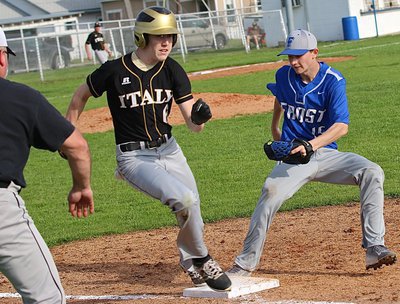 Image: Gladiator Clayton Miller(6) beats the Frost pitcher to the first-base bag, “Safe!”