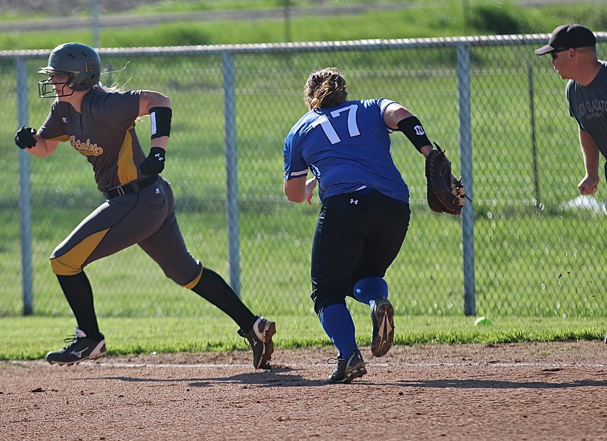 Image: Madison Washington(10) turns a single into  a three-bagger for the Lady Gladiators.