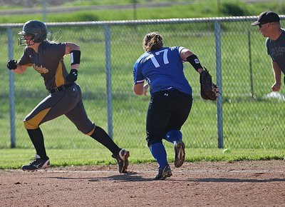Image: Madison Washington(10) turns a single into  a three-bagger for the Lady Gladiators.