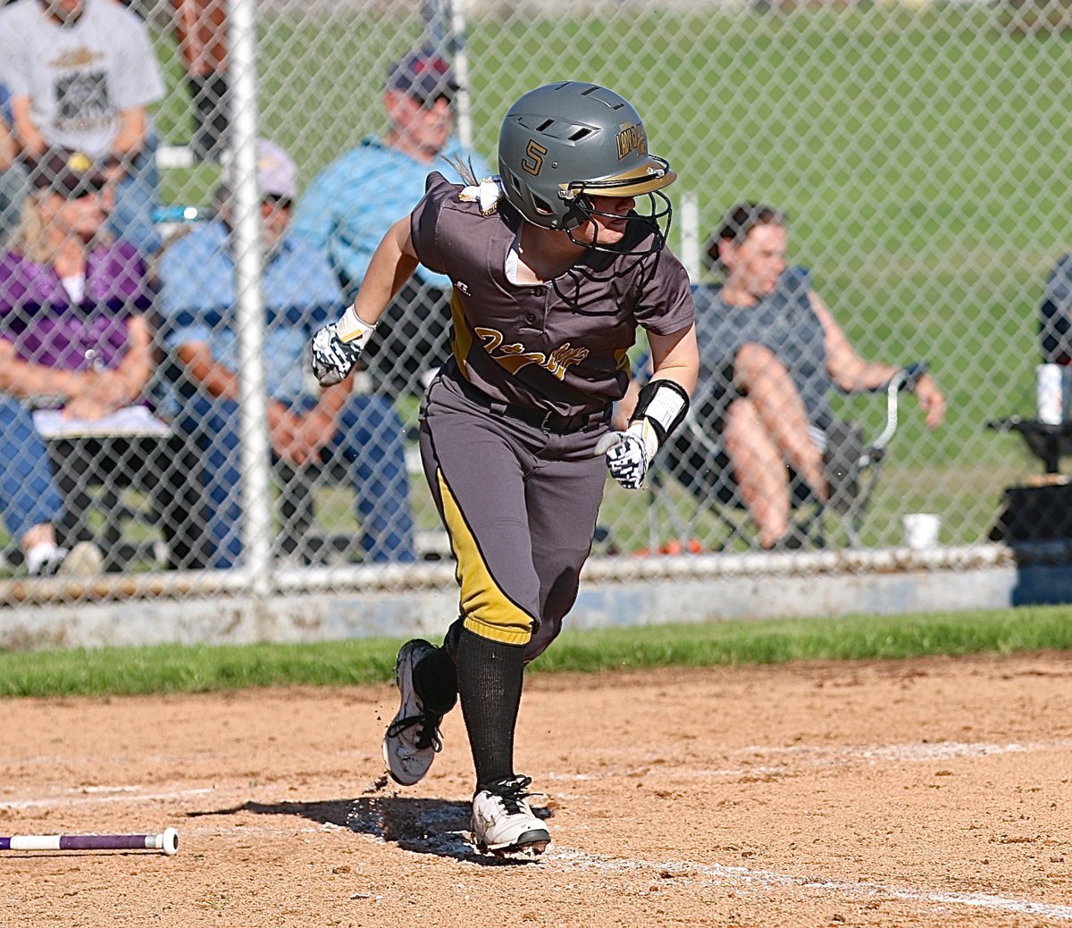 Image: Senior Tara Wallis(5) hits and then hurries to first-base for Italy.