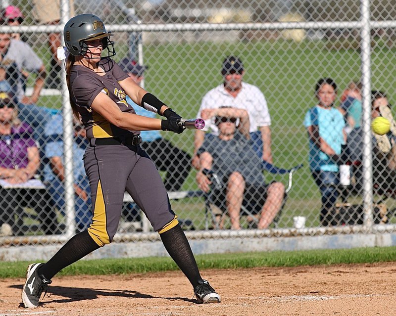 Image: Lady Gladiator Lillie Perry(9) ripples a blast past the Frost infielders.