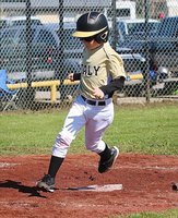 Image: Clayton Hellner hurries across home plate for an Italy run.