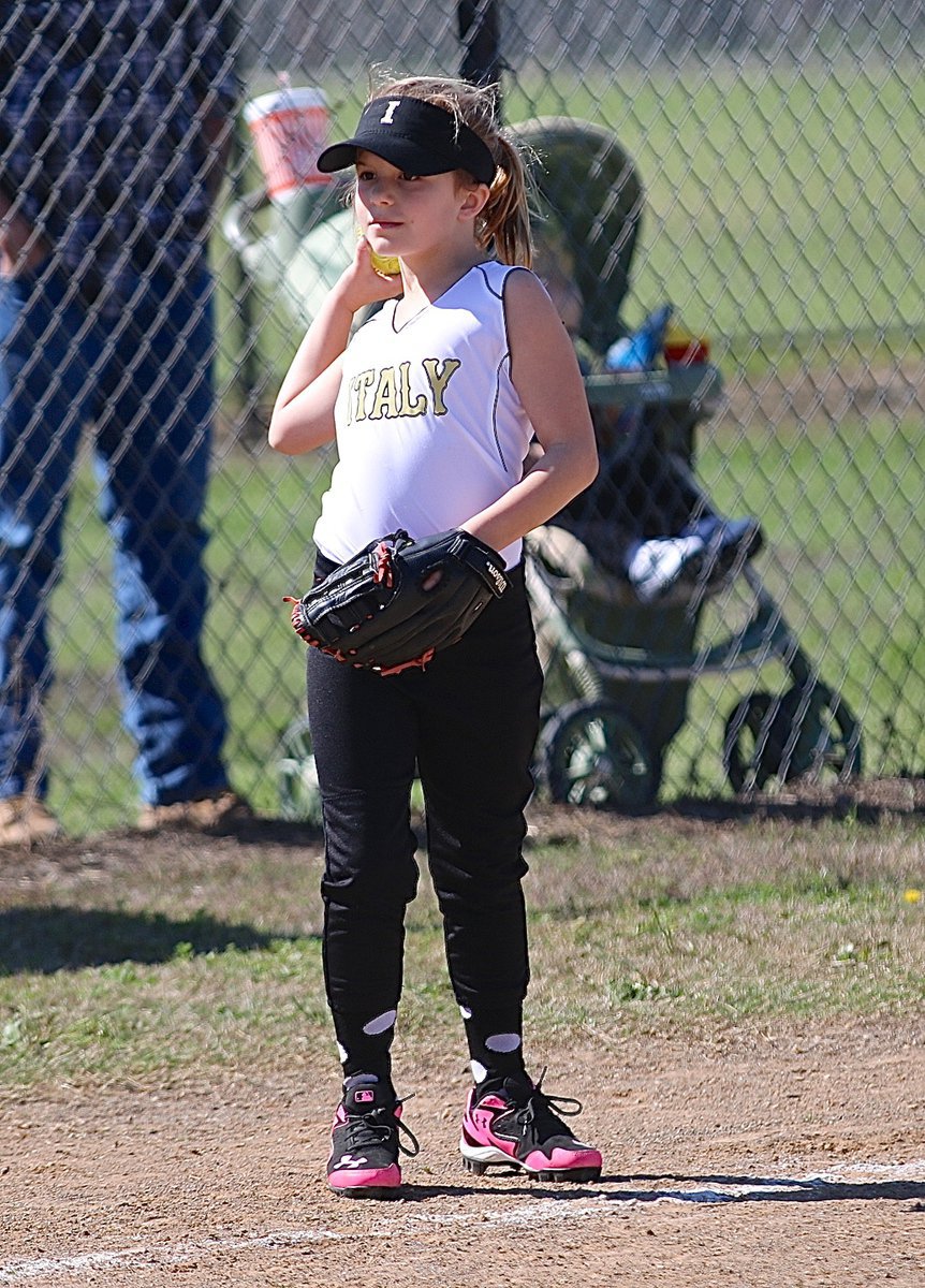 Image: Taylor Souder controls the ball at third base to stop the action.