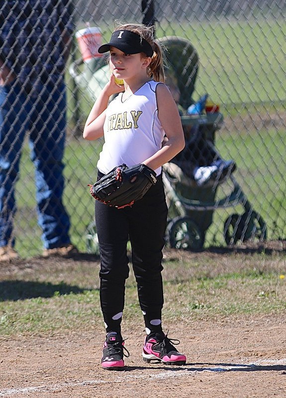 Image: Taylor Souder controls the ball at third base to stop the action.