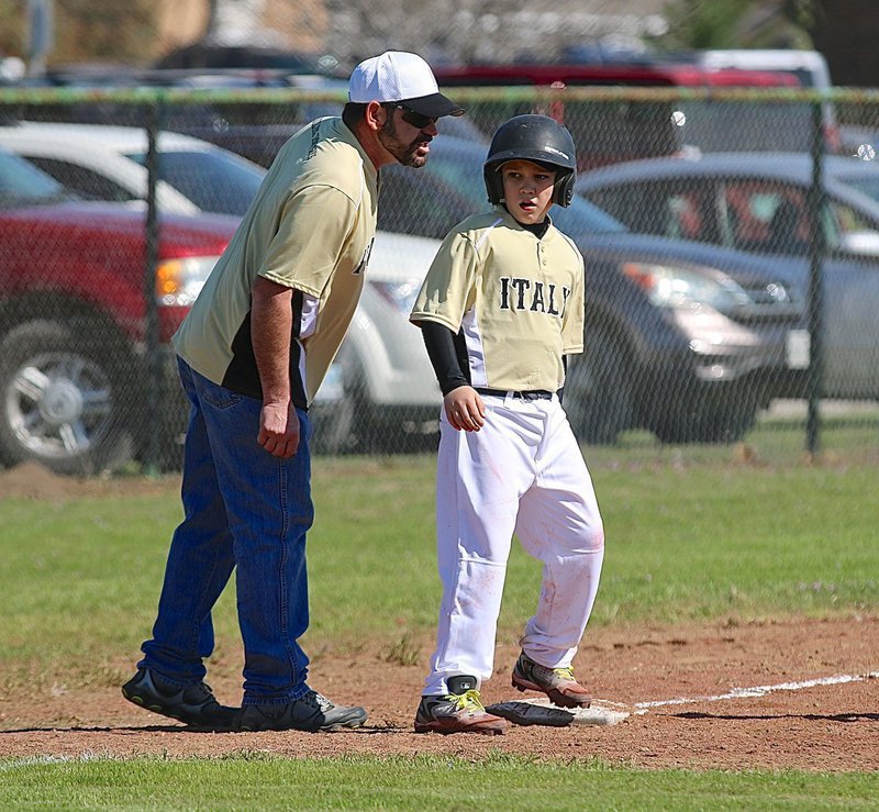 Image: Jay Copeland gets some encouraging words from his dad and coach, Nick Copeland.