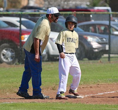 Image: Jay Copeland gets some encouraging words from his dad and coach, Nick Copeland.