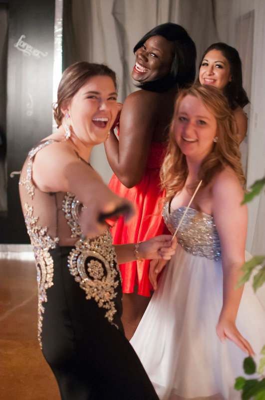 Image: Grace Haight, Rachel Huskins, Taleyia Wilson, and Elizabeth Garcia show off their pretty smiles and pretty dresses