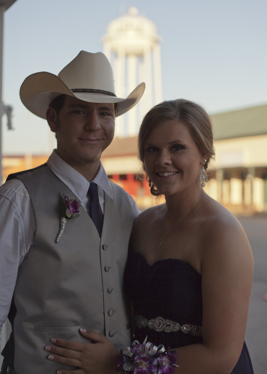 Image: Micah Escamilla and Lillie Perry pose in their attire before entering