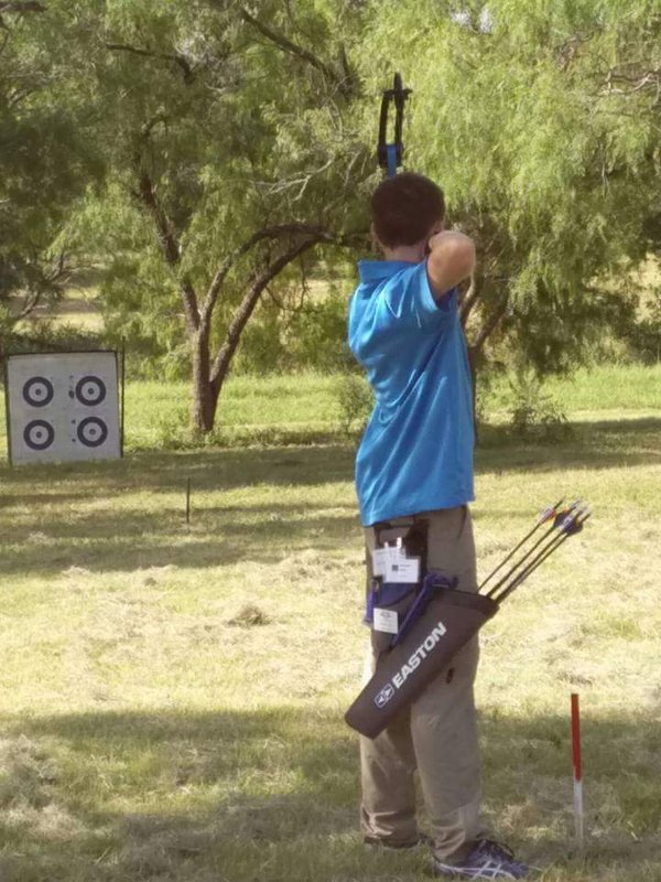 Image: Hunter Hinz takes aim during Field Archery during the state championships.