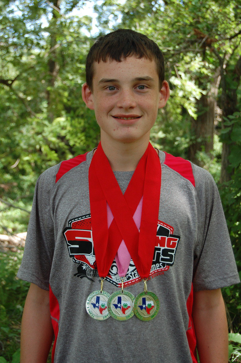 Image: Hunter Hinz, 13, of Italy proudly wears his state archery medals.