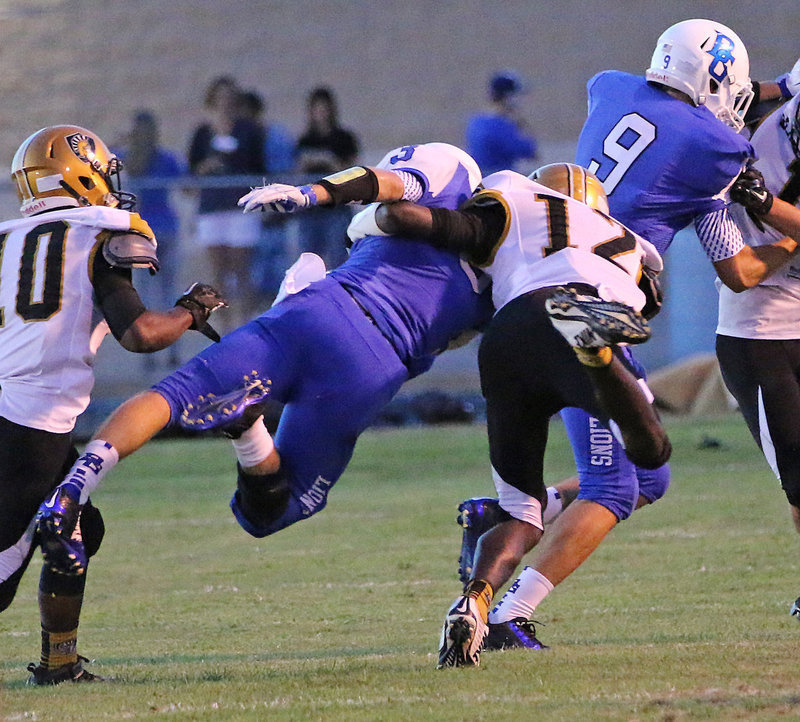 Image: Chasston King(12) and Kendrick Norwood(10) capture a Lion during a defensive safari.