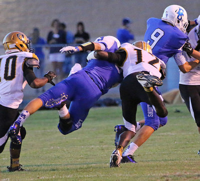 Image: Chasston King(12) and Kendrick Norwood(10) capture a Lion during a defensive safari.