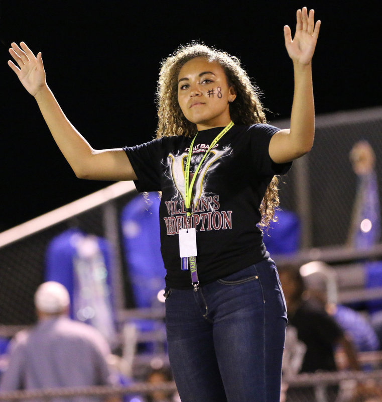Image: Drum major Vanessa Cantu conducts the Gladiator Regiment Band during halftime.
