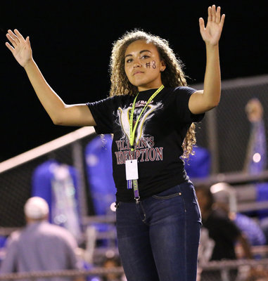 Image: Drum major Vanessa Cantu conducts the Gladiator Regiment Band during halftime.