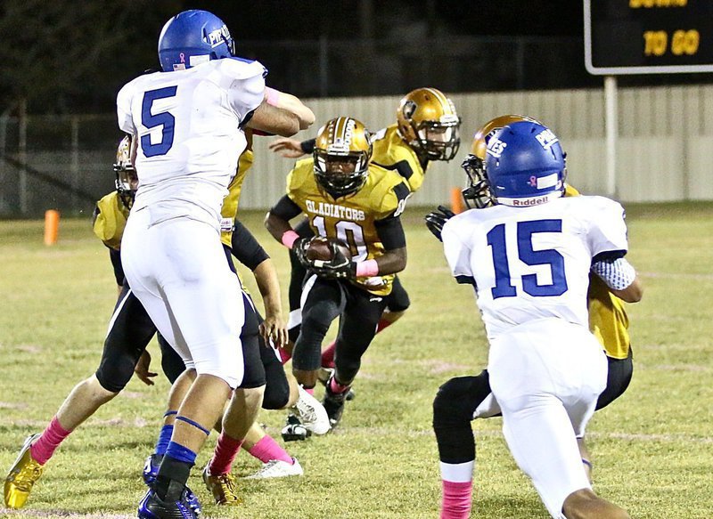 Image: Gladiator Kendrick Norwood(10) looks for some daylight under the Friday night lights at Willis Field in Italy.