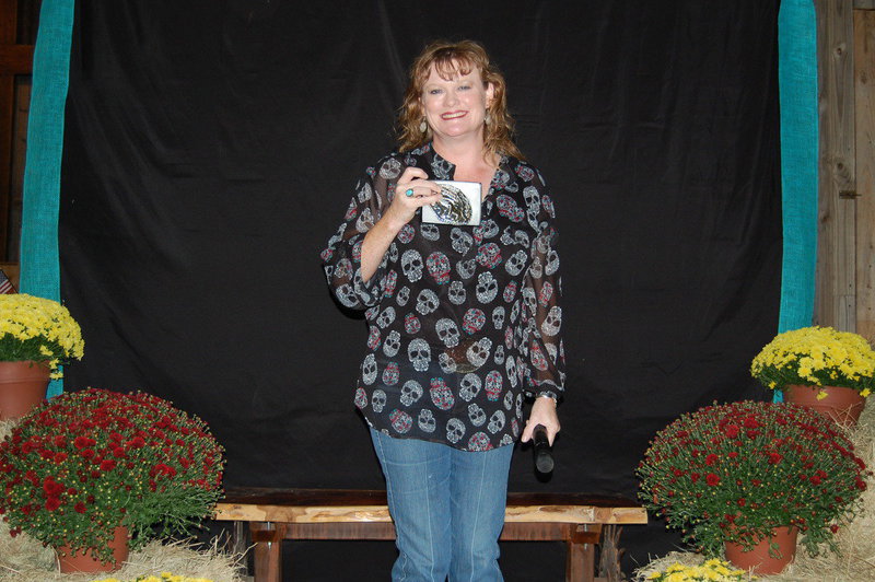 Image: Julie Hinz shows off her buckle for Junior Geldings at Halter.