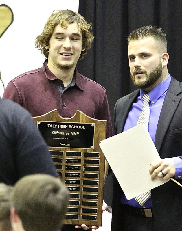 Image: Coach Daniel Weaver presents senior Ryan Connor with the Italy Gladiator Football Offensive MVP Award.