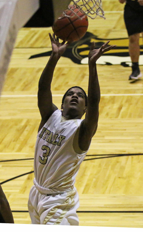 Image: Italy’s Al Waits(3) attacks the paint for two of his 10-points scored against Itasca during the JV Boys game.