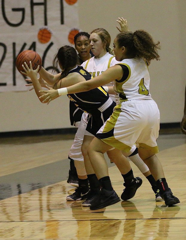 Image: Italy’s Vanessa Cantu(4) and teammate Brycelen Richards(11) converge on an Itasca ball handler during the JV Girls game.