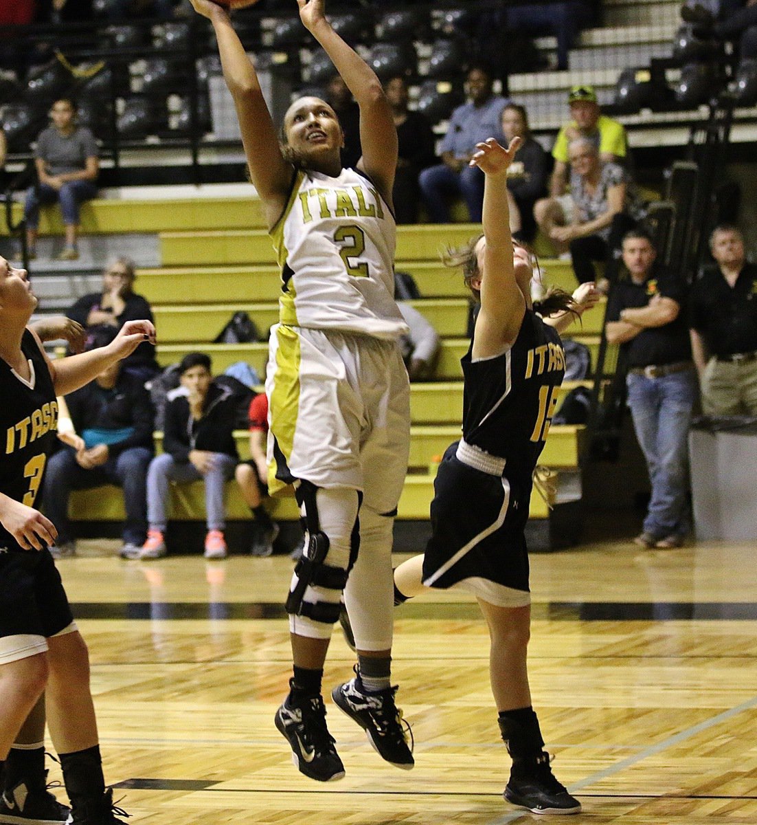 Image: Italy Lady Gladiator Emmy Cunningham(2) finishes this fast-break opportunity for two of her 22-points she put up against Itasca.