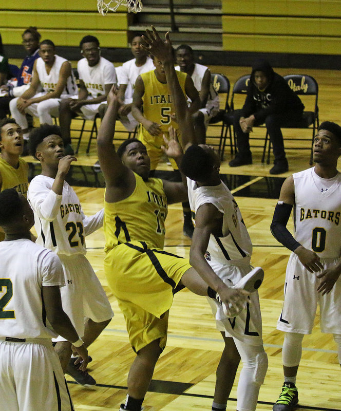 Image: Italy Gladiator Kenneth Norwood(13) grabs a rebound and then falls back to bank in a tough shot early.