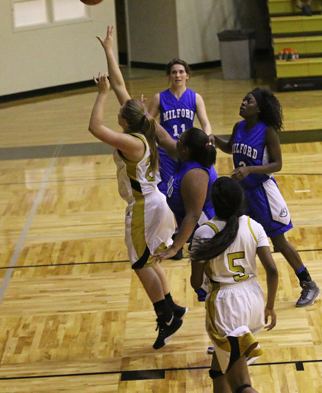 Image: Senior Lady Gladiator Lillie Perry(24) makes back-to-back buckets in the opening period to finish with 4-points against Milford.