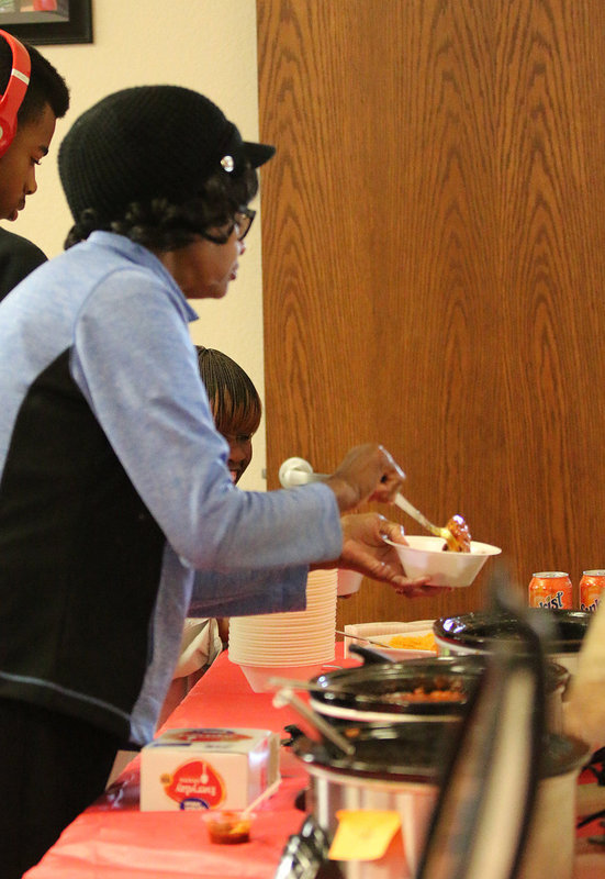 Image: Dorothy Anderson scoops her up some chili to try.