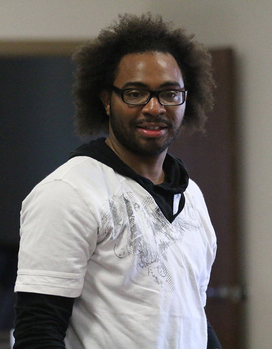 Image: A.J. Isaac is enjoying the chili cookoff as he stares down another pot of chili to sample.