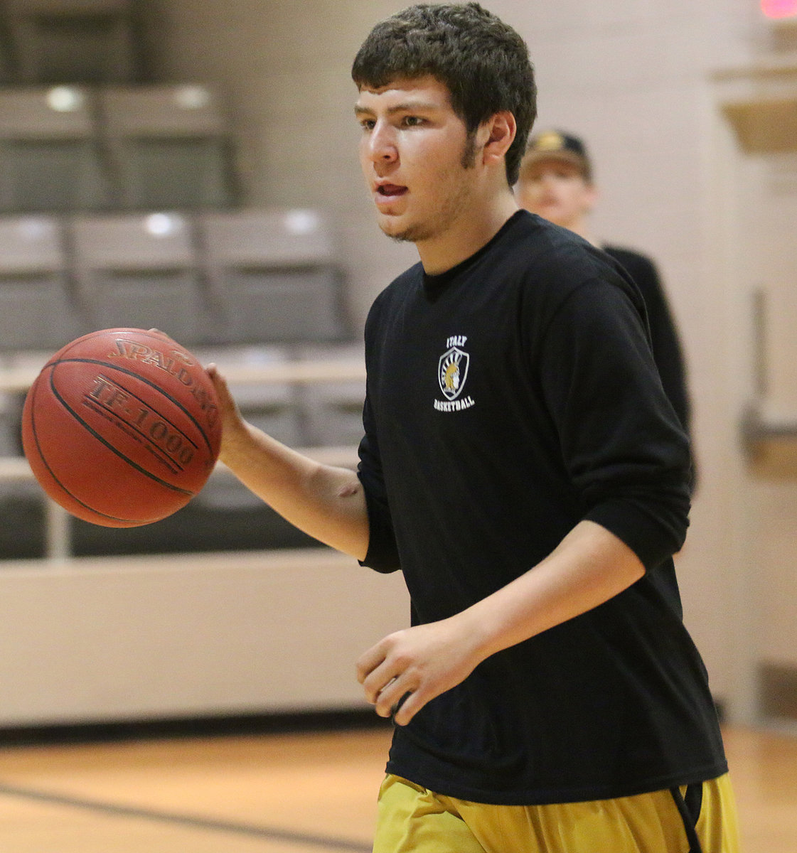 Image: Micah Escamilla gets game ready during warmups against Itasca.