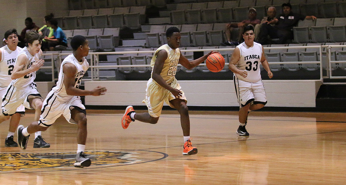 Image: Italy’s Anthony Lusk(20) steals the ball and breaks away down court against Itasca’s JV squad.