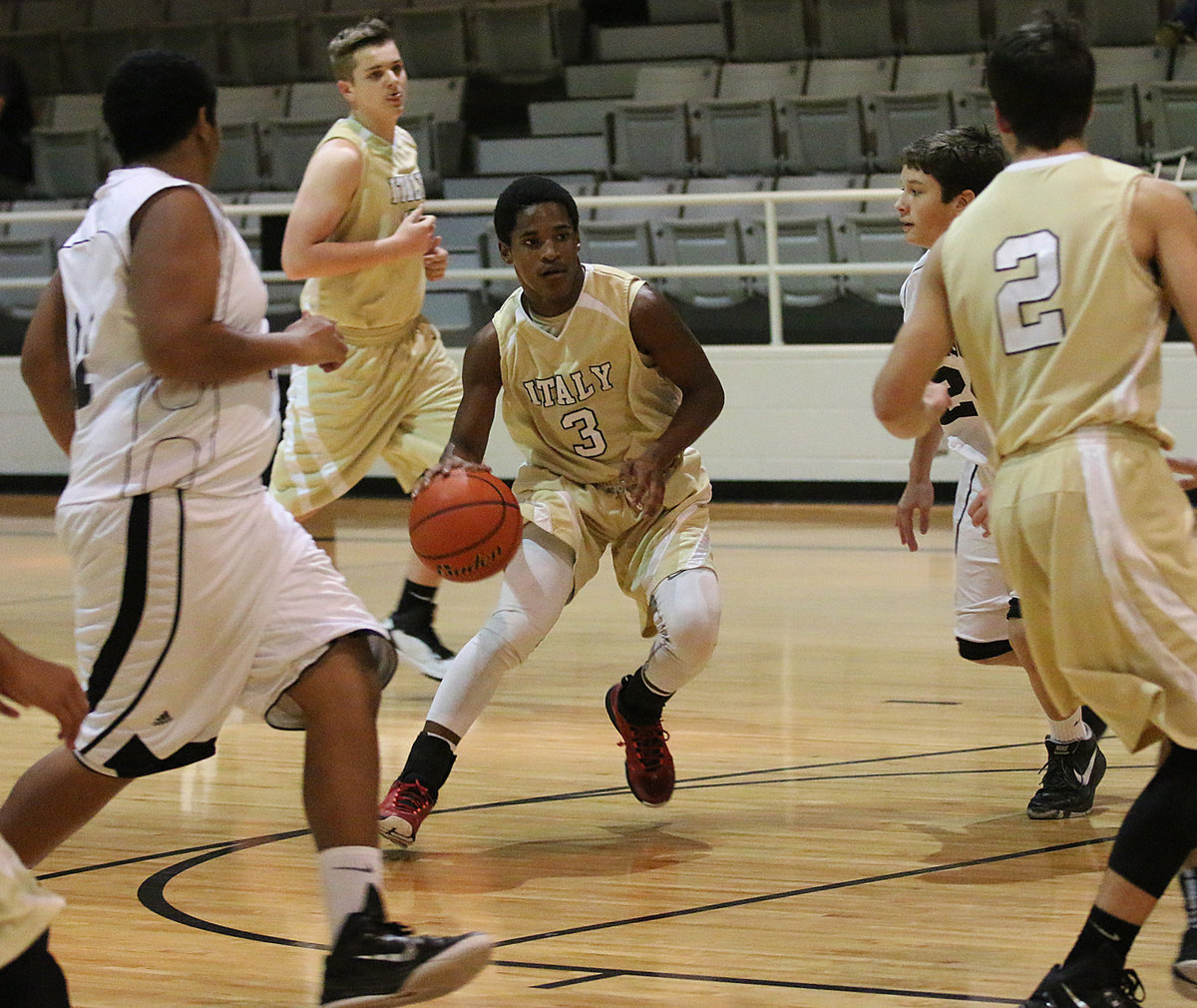 Image: Al Waits(3) waits for no one as he drives into the line against Itasca.