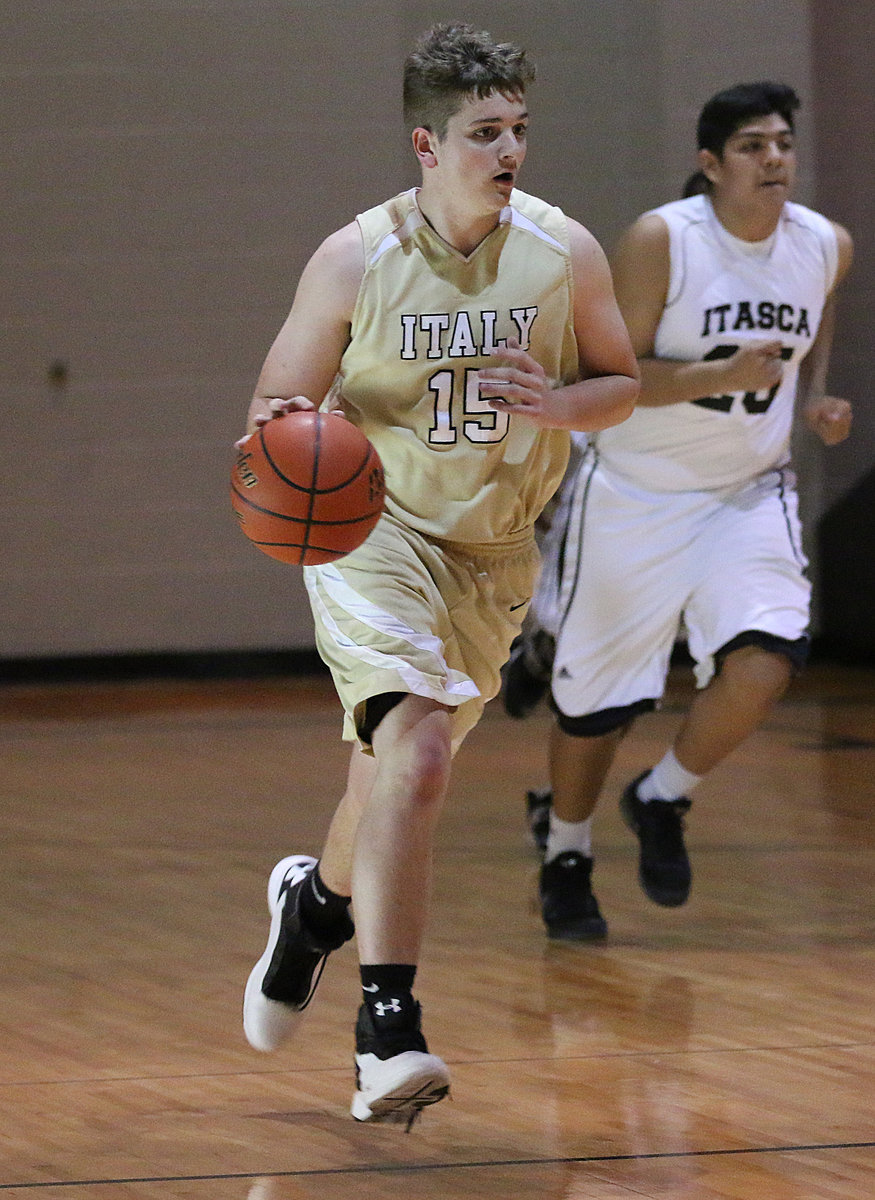 Image: Italy JV Gladiator James Walton(15), the big man, shows his dribbling skills while controlling the ball.