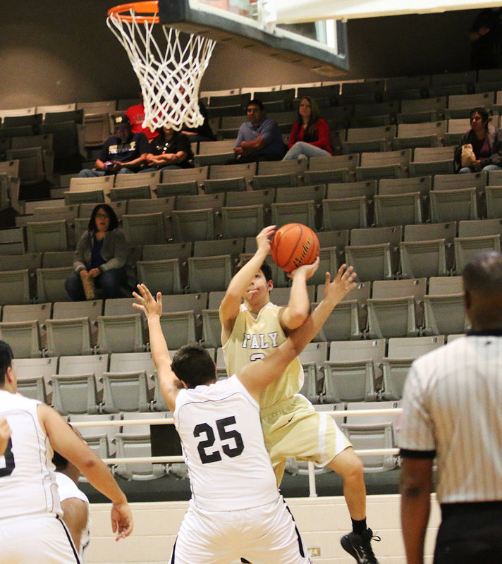 Image: Italy JV Gladiator Gary Escamilla(3) attacks from the wing as he leans in over a Wampus Cat defender.